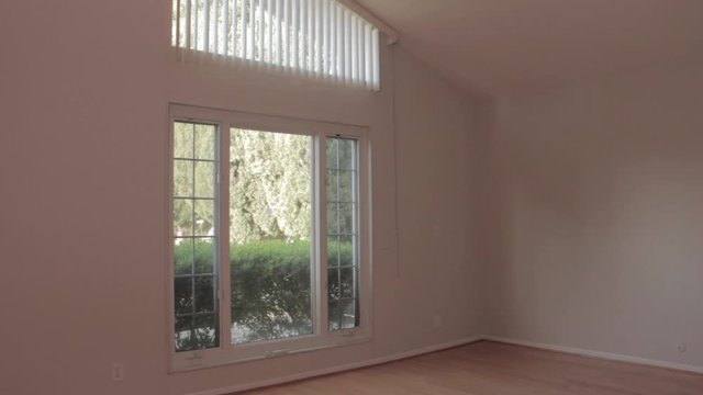 Empty master bedroom in small middle class family suburb house home