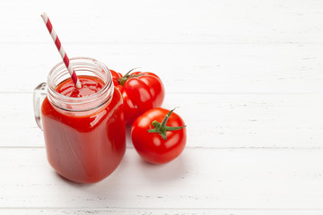 Fresh tomato juice and ripe tomatoes