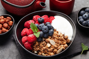 Healthy breakfast with granola, yogurt and berries