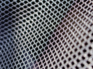 Black polyester mesh with large holes for free air circulation. Material for sportswear, animal...