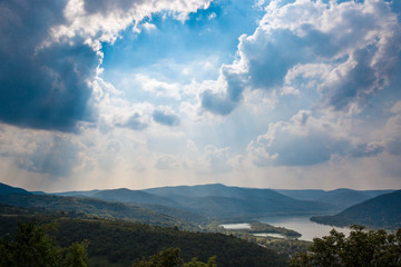 Fototapeta premium View hill near Visegrad castle in Hungary to Danube river. Travel destination. Sightseeing cruises. Forests, clouds and flowing water.