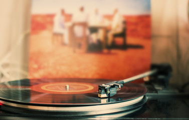 turntable with a record and a needle