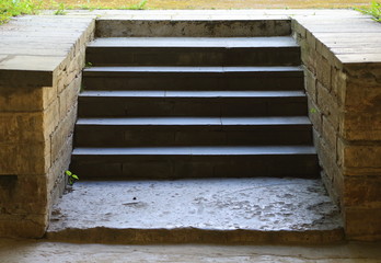 A narrow stone staircase with several steps