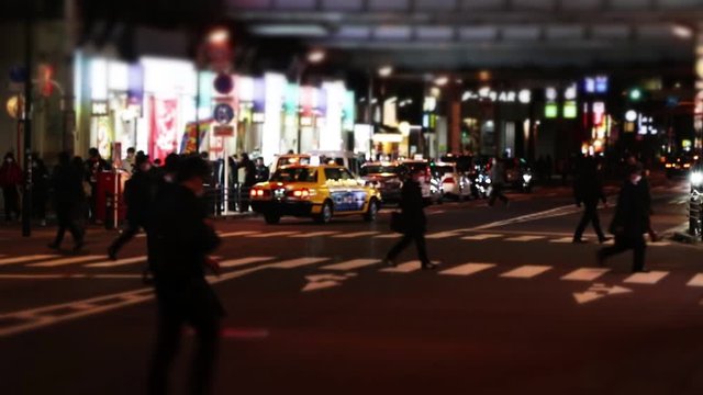 Night timelapse in Tokyo with view on highway and intersection.