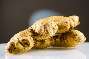 Closeup of fresh root ginger on plate