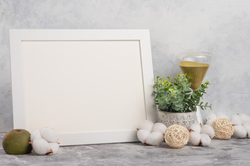 Empty white frame mockup on wall background with design accessories. Concept design and font...