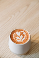 Fancy cup of coffee or hot chocolate in modern hipster cafe. Modern breakfast and coffee house concept