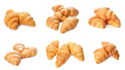 Set of tasty croissants on white background