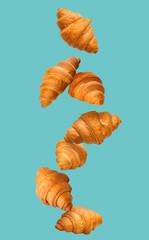 Tasty croissants on color background