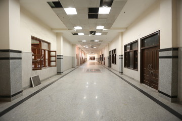 New Delhi, Delhi/India- May 20 2020: Empty corridor of a newly constructed hospital building with grey tiles and marbles.