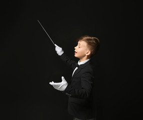 Little conductor on dark background