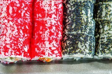 sushi rolls in a plastic thermo container