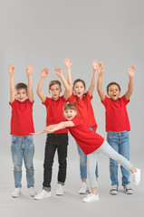 Obraz premium Cute little dancers on grey background