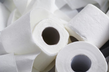 Toilet paper in a roll. Snow-white soft three-layer toilet paper. Lack of hygiene products. Primary protection and disinfection.
