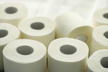 Toilet paper in a roll. Snow-white soft three-layer toilet paper. Lack of hygiene products. Primary protection and disinfection.