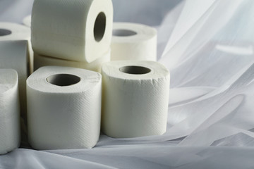 Toilet paper in a roll. Snow-white soft three-layer toilet paper. Lack of hygiene products. Primary protection and disinfection.