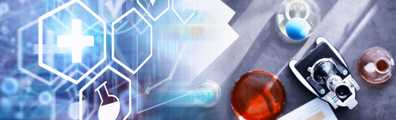 Laboratory research. Drug testing. Chemical experiments in the laboratory. Microscope various test tubes and beakers on the table at the medical officer.
