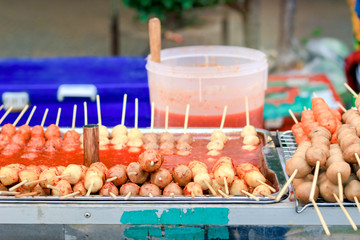 Fried food and meat ball with sticks, Thai street food market, exotic food