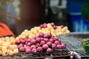 Man thip (exotic food), Thai dessert at street food market, grilled sweet potato balls, roasted mashed potato balls