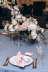 Wedding flowers on the banquet table. Table decoration.