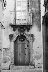 Old wooden and metal portal with lock. Vintage artistic design
