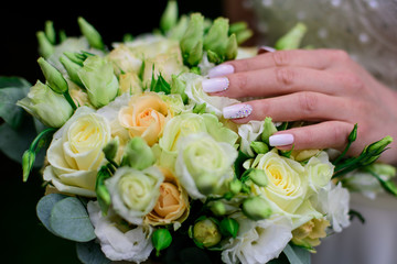 Obraz na płótnie Canvas French wedding manicure with flowers and beads