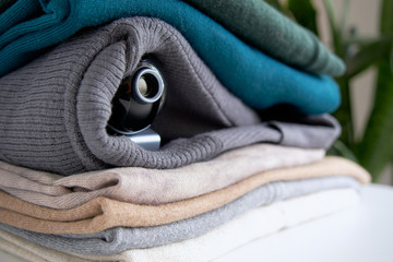 Webcam hidden in a stack of clothes for covert surveillance of the house. Surveillance and security...