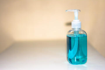 Blue bottle of hand sanitizer and anti-bacterial hand gel, Hand washing, Hand hygiene for Corona virus prevention 
