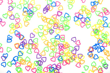 many color plastic heart shape as background , toy for child