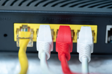 Ethernet cables connect to router or switch port