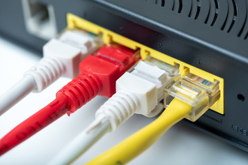 Ethernet cables connect to router or switch port