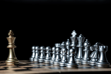 The confrontation between gold king chess and silver chess team ,  business strategy concept