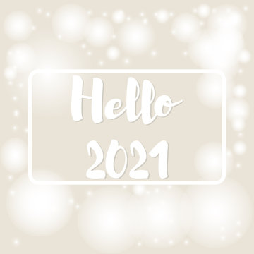 Beige background with bokeh and lights and frame for text hello 2021 for festive greeting cards