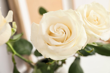Bouquet of beautiful white roses in room, closeup