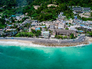 Fototapeta premium Aerial view of quiet beautiful sunny day Kalim beach near Patong beach in Phuket Thailand during locked down policy due to Covid-19. All beaches in Phuket are not allowed to enter.