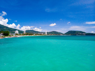 Aerial view of quiet beautiful sunny day Patong beach in Phuket Thailand during locked down policy due to Covid-19. All beaches in Phuket are not allowed to enter.