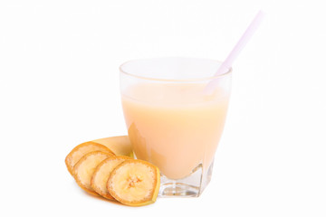 Banana juice in a glass with sliced bananas
