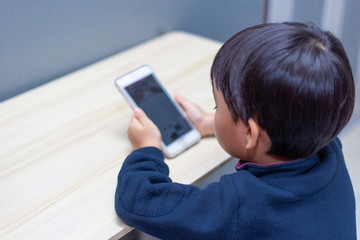 Leisure life of children at home Using a mobile phone
