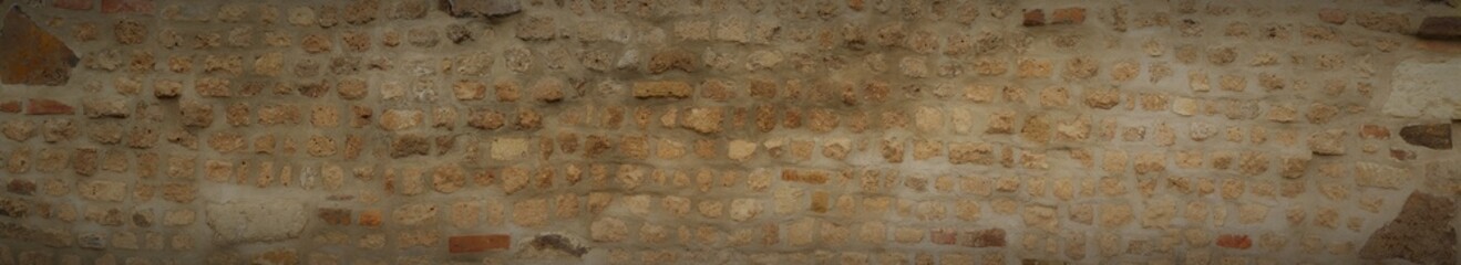 Brown old brick wall in 16: 9 in ultra wide format.