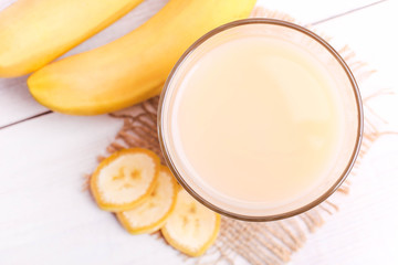 Banana juice in a glass with sliced banana