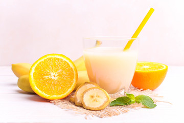 Banana juice in a glass with fruits