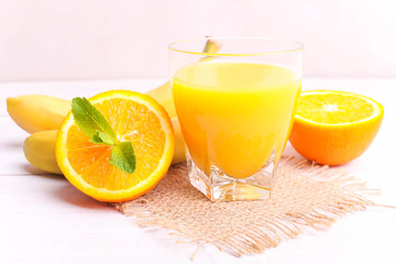 Orange juice in a glass with fruits