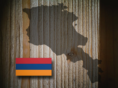 Map and flag of Armenia on a wooden background, 3D illustration.