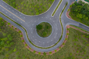 Aerial view of an empty roundabout asphalt road