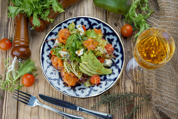 Salad from tomatoes, cucumber, red onions and lettuce leaves. healthy summer vitamin menu. vegan vegetable food. vegetarian dinner table. top view. flat lay