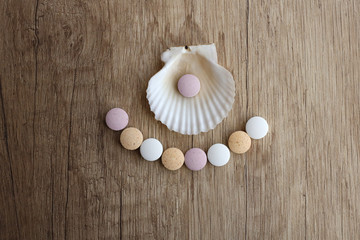 Medical tablets on a wooden background.Medicines on a wooden background.Flat lay, blur