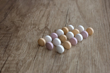 Fototapeta na wymiar Medical tablets on a wooden background.Medicines on a wooden background.Flat lay, blur