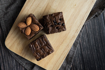 brownies cut in squares. Dark food photography concept