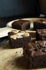 brownies cut in squares. Dark food photography concept