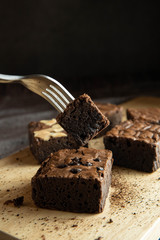 brownies cut in squares. Dark food photography concept